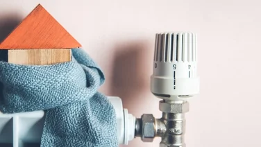 model house with a scarf on a radiator