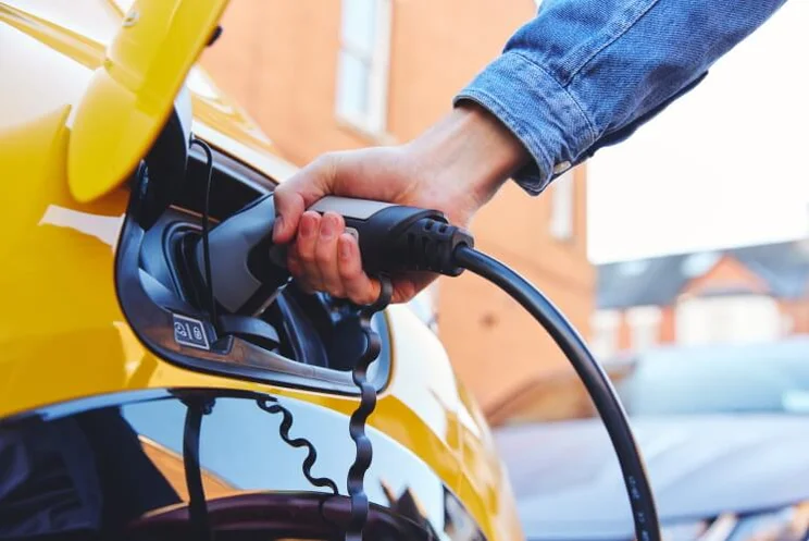 person using an ev charger