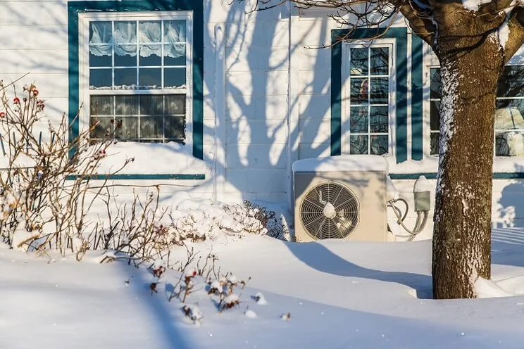 Air source heat pump in the snow