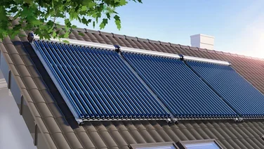 Three solar thermal panels on the roof of a house