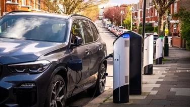 electric vehicle being charged on a street