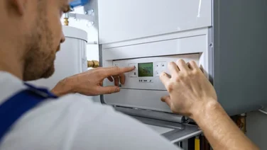 person installing a boiler