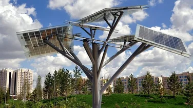 Solar tree with solar panels on each branch angled at different directions facing the sky